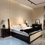 Cream Leather Upholstered Bed with Dark Natural Wood Veneer Trim, Embossed Brand Emblem & Copper-Accented Hardware